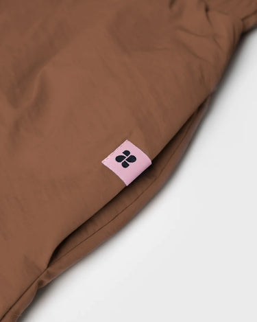 Brown vegan winter skirt with recycled materials tag and smooth fabric texture. - The New Orchard - Brown / S