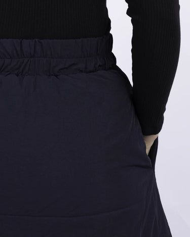 Navy vegan skirt with elastic waistband made from recycled materials, shown mid-length on model. - The New Orchard - Navy Blue / S