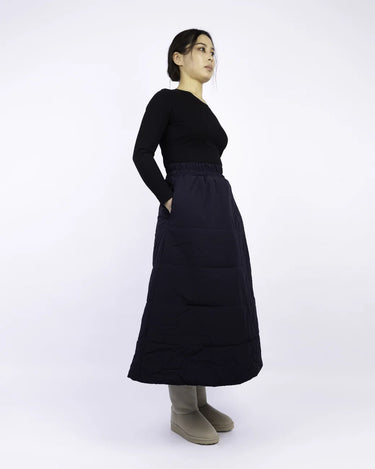 Navy blue vegan winter skirt made from recycled materials, featuring a long A-line silhouette and side pockets. - The New Orchard - Navy Blue / S