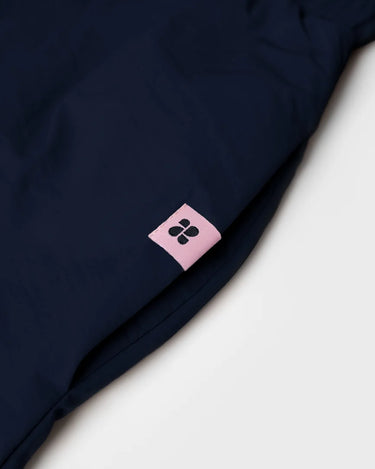 Navy vegan skirt made from recycled materials with pink branded tag detail. - The New Orchard - Navy Blue / S