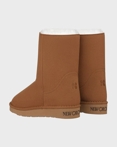 Caramel brown mid-calf vegan boots with faux fur lining