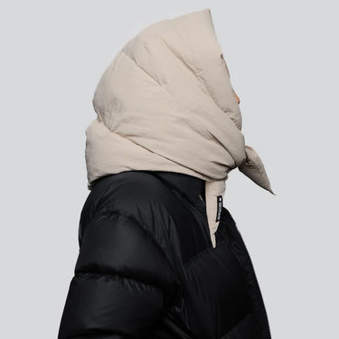 Light beige vegan winter capuche made from recycled materials, styled with black puffer jacket. - The New Orchard - Light Beige