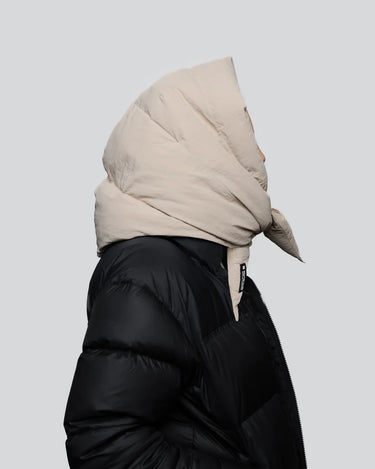 Light beige vegan winter capuche made from recycled materials, styled with black puffer jacket. - The New Orchard - Light Beige