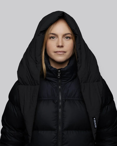 Charcoal black vegan puffer jacket with hood made from recycled materials, featuring a front zipper and sleek insulation. - The New Orchard - Charcoal Black