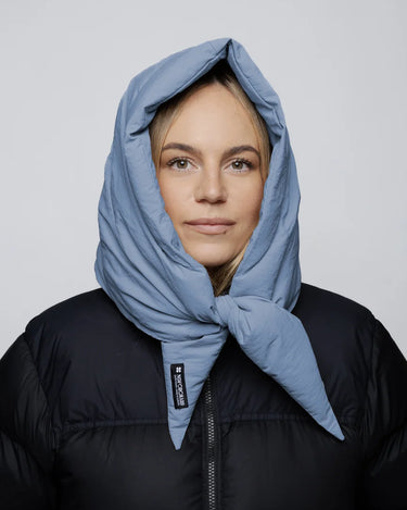 Sky blue vegan capuche made from recycled materials, styled over black puffer jacket. - The New Orchard - Sky Blue
