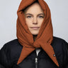 Vegan cinnamon-colored winter capuche made from recycled materials, styled over a black puffer jacket. - The New Orchard - Fresh Cinnamon