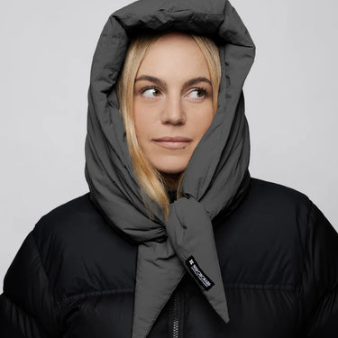 Light grey vegan winter capuche with tie detail made from recycled materials worn with black puffer jacket. - The New Orchard - Light Grey
