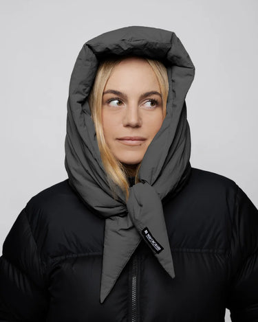 Light grey vegan winter capuche with tie detail made from recycled materials worn with black puffer jacket. - The New Orchard - Light Grey