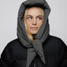 Light grey vegan winter capuche with tie detail made from recycled materials worn with black puffer jacket. - The New Orchard - Light Grey