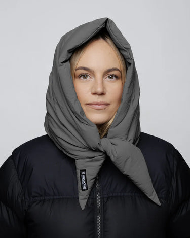 Grey padded vegan winter capuche made from recycled materials worn over a black jacket. - The New Orchard - Light Grey