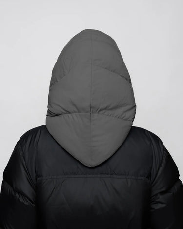 Grey vegan winter capuche with recycled materials, shown from back on black puffer jacket. - The New Orchard - Light Grey