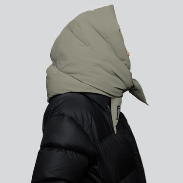 Khaki vegan winter hood with recycled materials paired with black puffer jacket side view. - The New Orchard - Natural Khaki