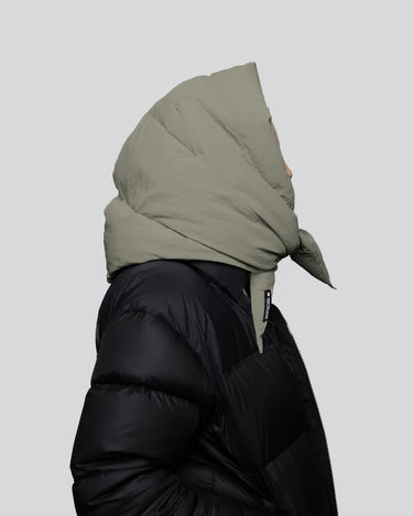 Khaki vegan winter hood with recycled materials paired with black puffer jacket side view. - The New Orchard - Natural Khaki