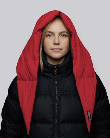 Vivid red winter vegan capuche made from recycled materials worn over black puffer jacket. - The New Orchard - Vivid Red