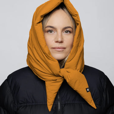 Amber yellow vegan hood made from recycled materials, styled over black puffer jacket. - The New Orchard - Amber Yellow
