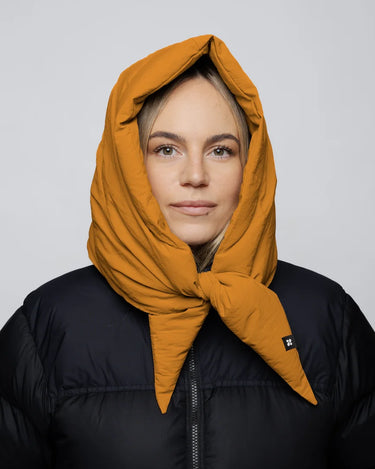 Amber yellow vegan hood made from recycled materials, styled over black puffer jacket. - The New Orchard - Amber Yellow