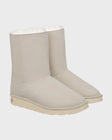 Off-white mid-calf vegan boots with faux fur trim