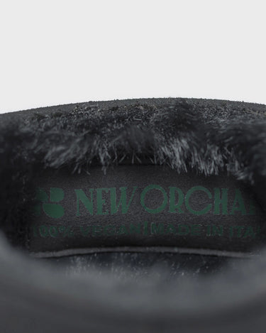 Sustainable black with green sole boots – cruelty-free