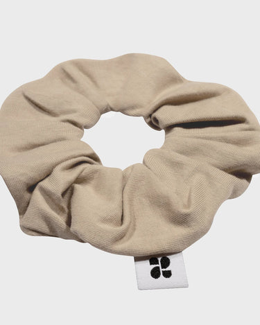 Sustainable beige scrunchie made from recycled materials