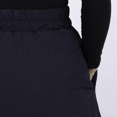 Navy vegan skirt with elastic waistband made from recycled materials, shown mid-length on model. - The New Orchard - Navy Blue / S