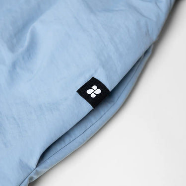 Sky blue winter vegan skirt made from recycled materials with black logo tag. - The New Orchard - Sky Blue / S